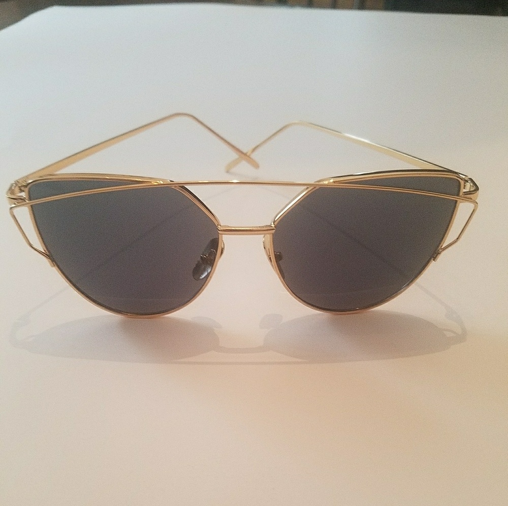 Gold rimmed cat eye aviator sunglasses